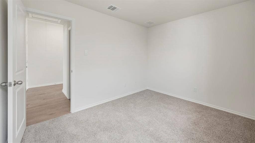 1916 Freeman Street, Tyler, TX 75704 Room featuring light gray carpeting, white walls, and white baseboards
