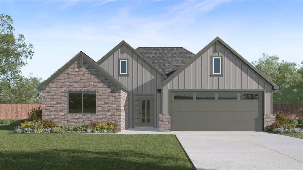 1928 Freeman Street, Tyler, TX 75704 Exterior featuring a mixed material facade, gabled rooflines, an attached two-car garage, a concrete driveway, and established landscaping