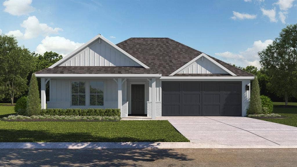 1924 Freeman Street, Tyler, TX 75704 Modern farmhouse exterior featuring white board and batten siding, dark shingle roofing, and a two-car garage with dark paneled doors
