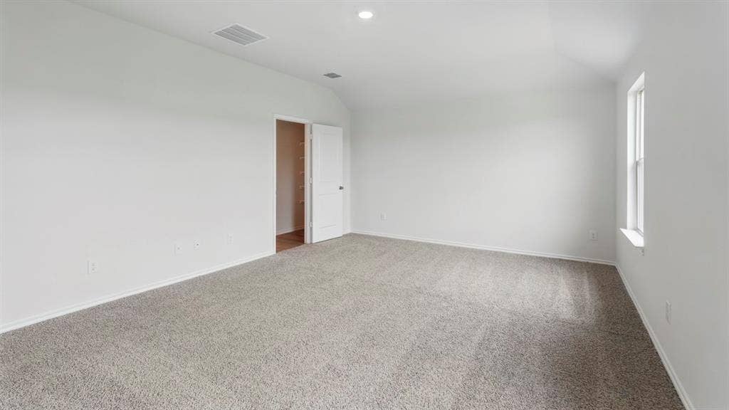 1924 Freeman Street, Tyler, TX 75704 Room featuring neutral carpet, white walls, and a single window