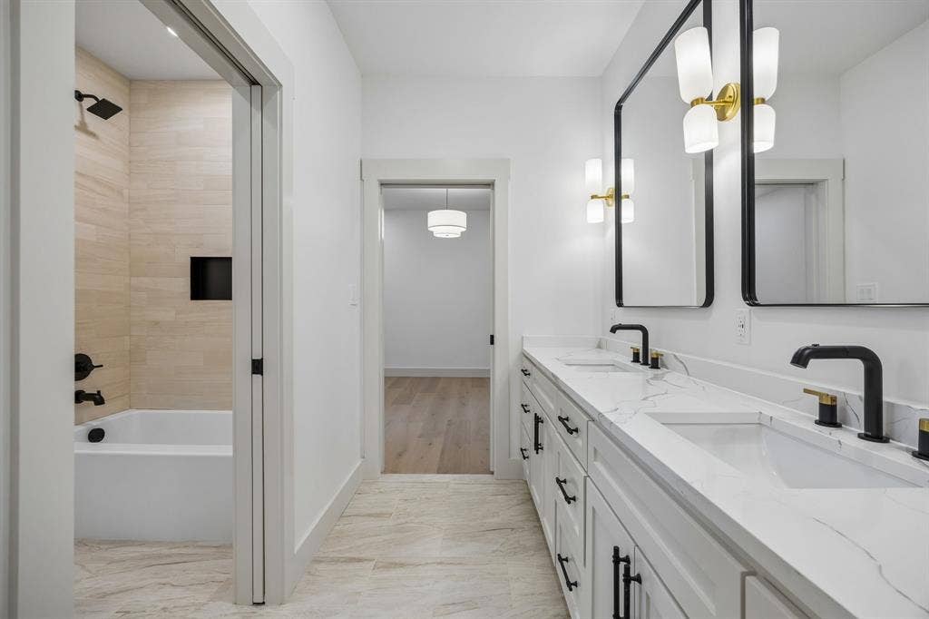 3027 Brooklyndell Avenue, Dallas, TX 75211 Dual vanity with white cabinetry and quartz countertops