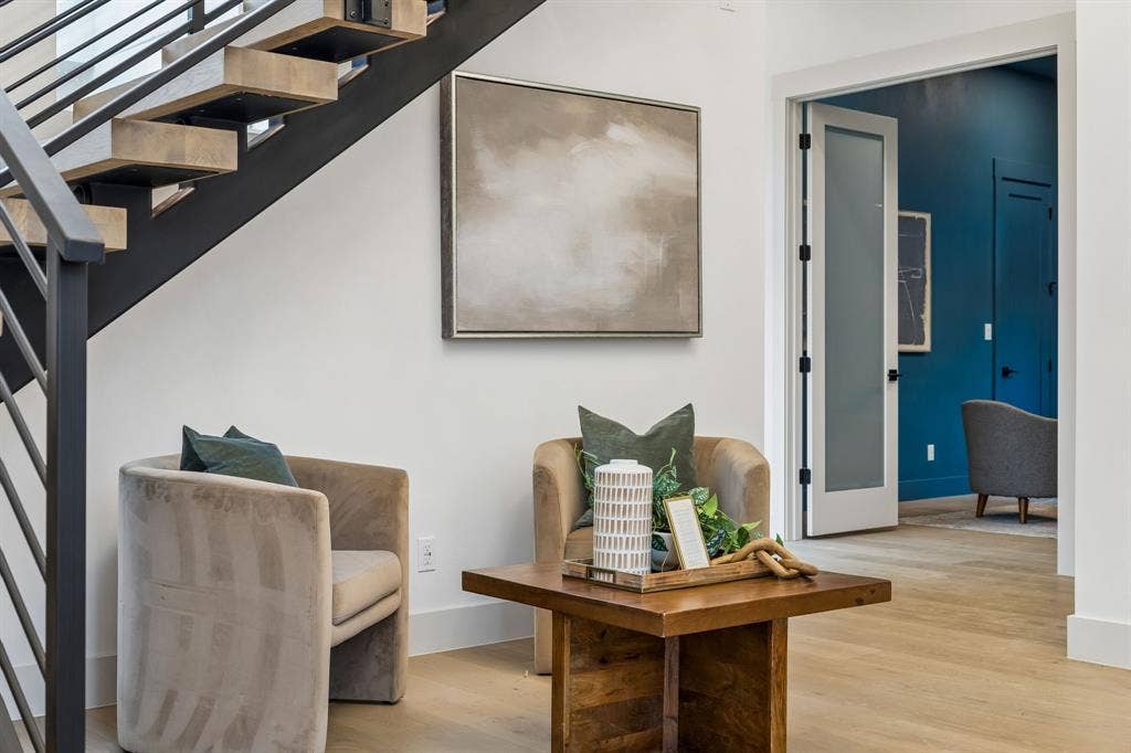 3027 Brooklyndell Avenue, Dallas, TX 75211 Floating staircase with dark metal railings