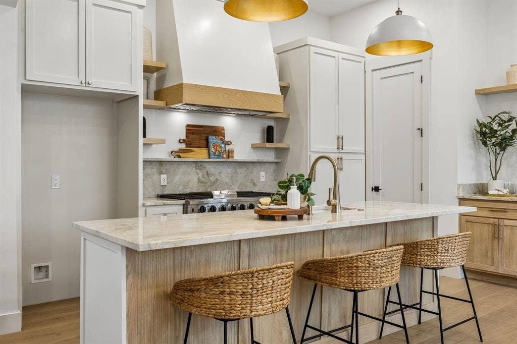 3027 Brooklyndell Avenue, Dallas, TX 75211 Kitchen with an island featuring seating