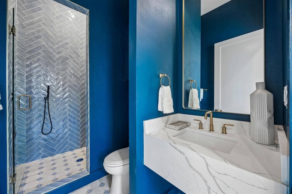 3027 Brooklyndell Avenue, Dallas, TX 75211 Full bathroom on the first floor with a shower.