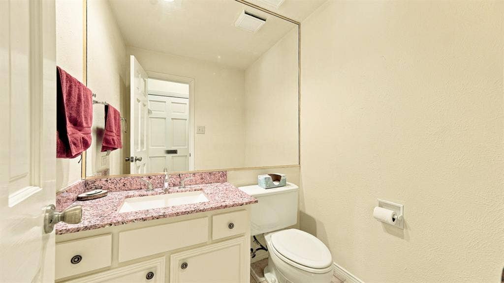 4325 Bellaire Drive S, Fort Worth, TX 76109 half bath by front door, granite, drawers, cabinets
