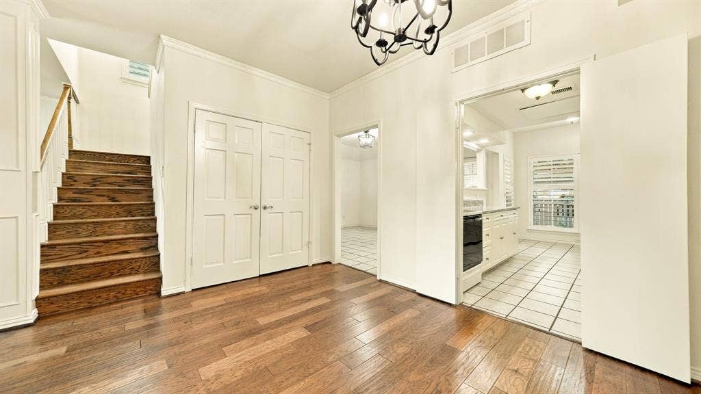 4325 Bellaire Drive S, Fort Worth, TX 76109 dining room flows to den & kitchen, newer wood staircse, storage closet