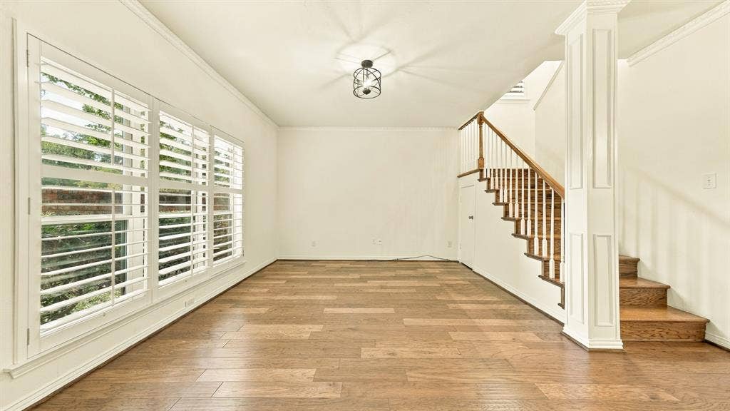4325 Bellaire Drive S, Fort Worth, TX 76109 living room newer windows and plantation shutters,newwer wood staircas