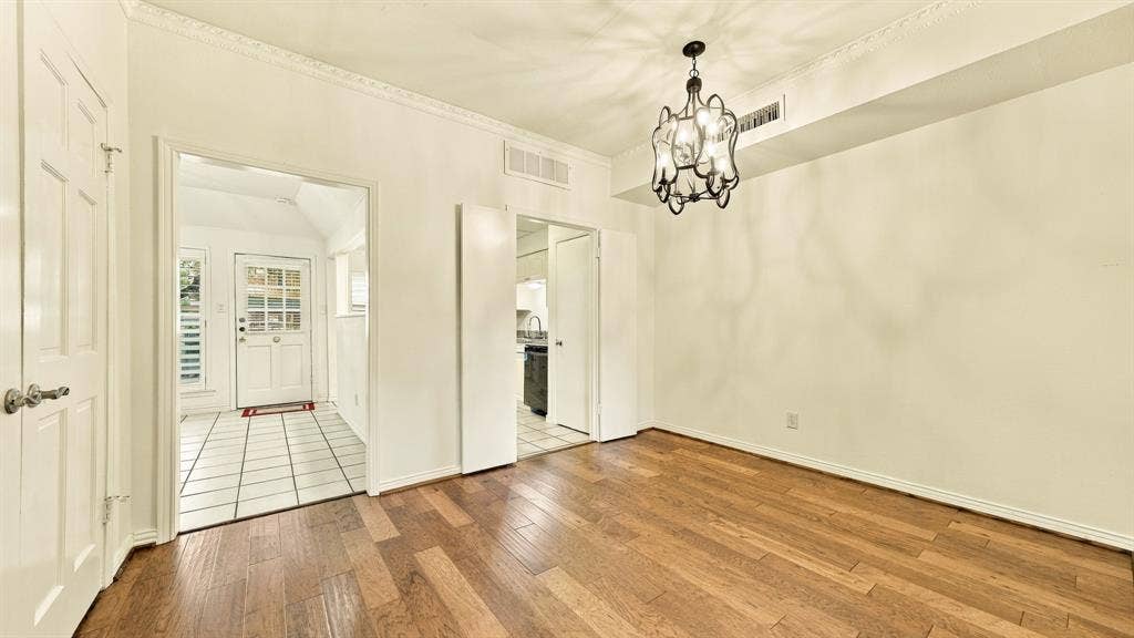 4325 Bellaire Drive S, Fort Worth, TX 76109 center of home, new modern light fixture, door into kitchen, door into den