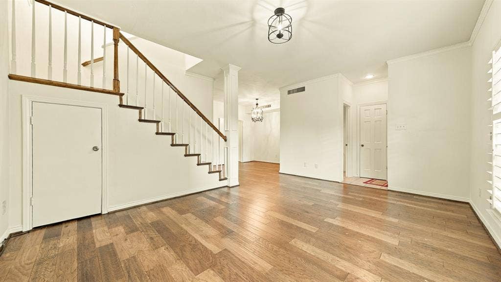4325 Bellaire Drive S, Fort Worth, TX 76109 living room & dining, newer wood stairs, storage under stairs