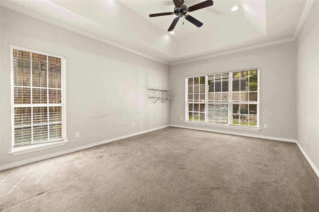 618 Huntwick Lane, Tyler, TX 75703 Recessed lighting, ceiling fan, tray ceiling, crown molding, and large windows