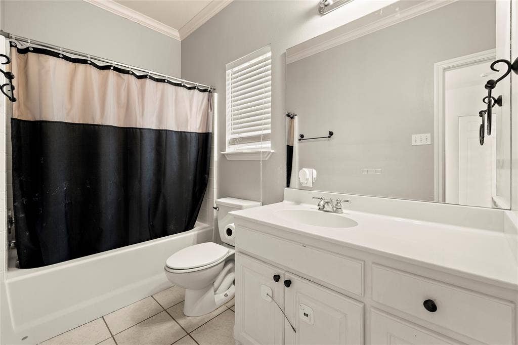 618 Huntwick Lane, Tyler, TX 75703 White vanity with panel cabinetry and dark hardware
