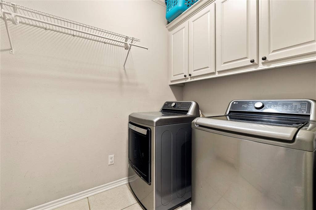 618 Huntwick Lane, Tyler, TX 75703 Upper cabinetry with black hardware, wire shelving, and tiled flooring