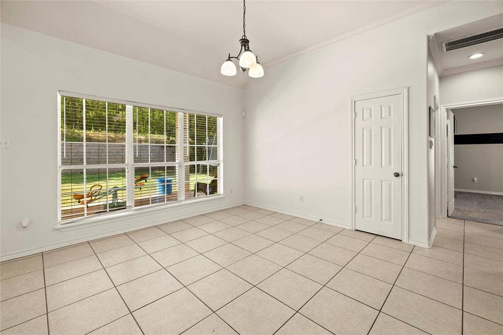 618 Huntwick Lane, Tyler, TX 75703 Vaulted ceilings, tile flooring, window blinds, and a multi-pane window