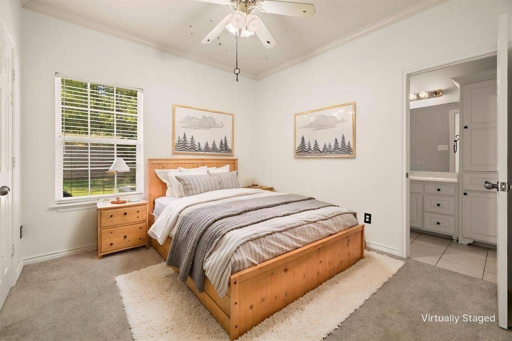 618 Huntwick Lane, Tyler, TX 75703 Neutral tone wall paint, crown molding, ceiling fan, carpet flooring, and a window with blinds