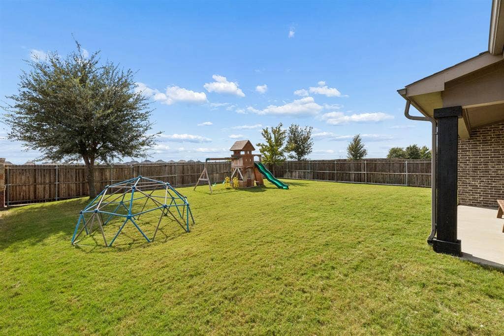 3707 Roth Drive, McKinney, TX 75071 Generously sized backyard offers an exceptional private setting with expansive lawn space, mature landscaping, a covered patio, and dedicated play areas. The thoughtfully landscaped grounds provide plenty of room for recreation, gatherings, pets, and outdoor living.