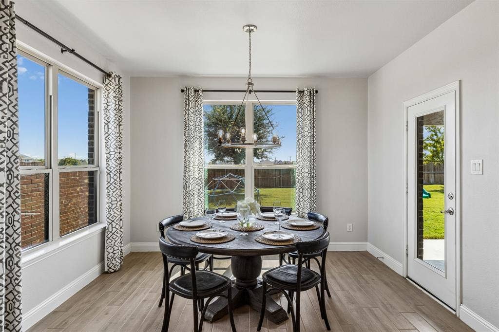 3707 Roth Drive, McKinney, TX 75071 The large breakfast area offers a beautiful place to eat casual meals with easy access to the backyard.