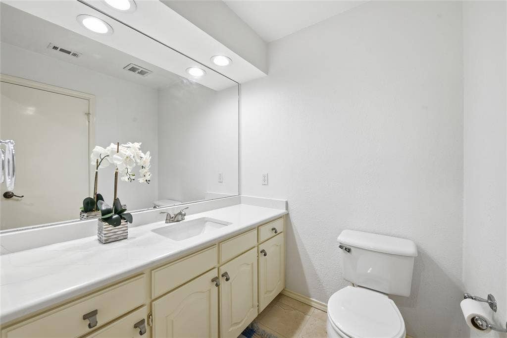4424 Westridge Avenue, Fort Worth, TX 76116 Extended vanity with integrated sink, ample counter space, and cabinet storage