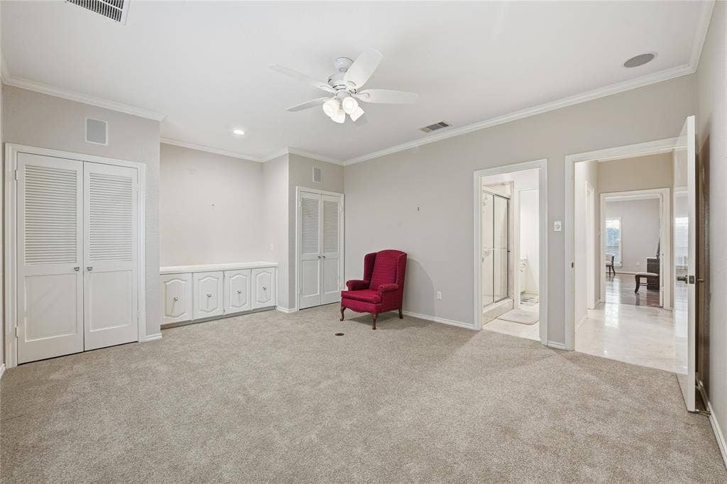 4424 Westridge Avenue, Fort Worth, TX 76116 Neutral-toned carpeting, ceiling fan with integrated lighting, built-in cabinetry with decorative hardware, louvered bi-fold doors, and recessed ceiling lighting