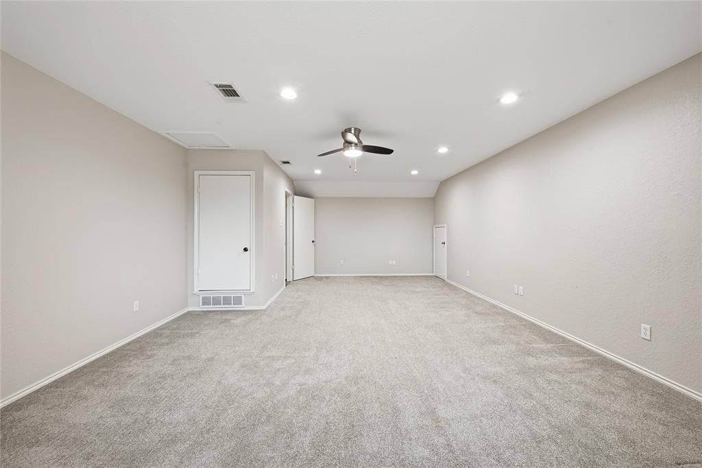 4424 Westridge Avenue, Fort Worth, TX 76116 Spacious room featuring neutral carpeting, recessed lighting, and a ceiling fan