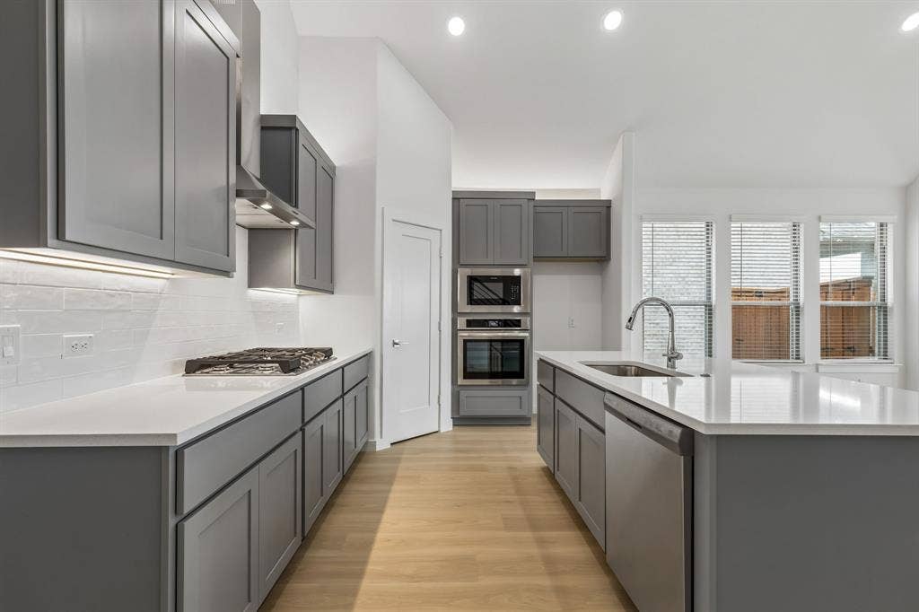 4612 Carina Road, McKinney, TX 75071 Kitchen in the Claret home plan – REPRESENTATIVE PHOTO