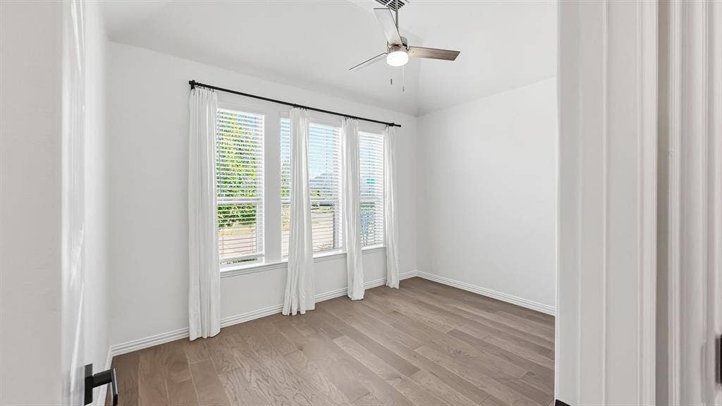3129 Grayslick Avenue, Celina, TX 75009 Light wood-finish flooring with white walls and trim