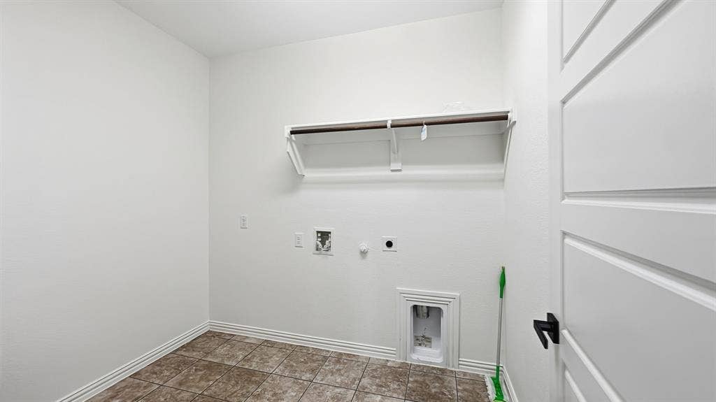 3129 Grayslick Avenue, Celina, TX 75009 White walls with a single shelf and hanging rod
