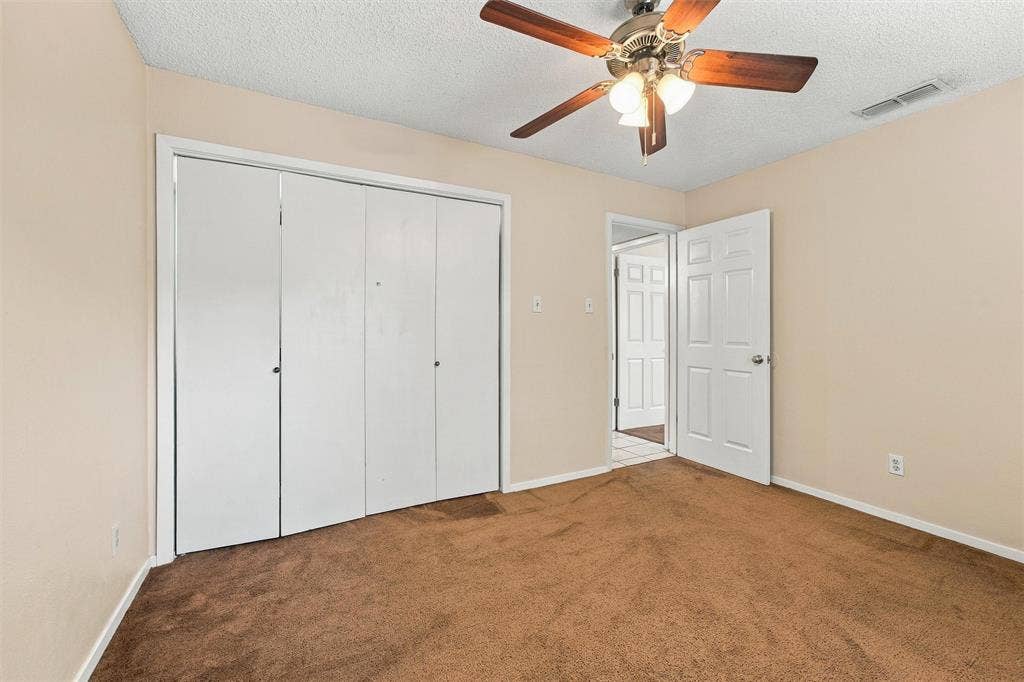 410 W Franklin Street, #5, Waxahachie, TX 75165 Expansive brown carpeting and light-toned walls