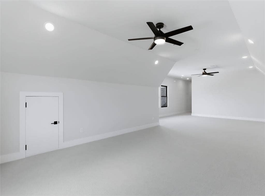 2608 Southbay, Northlake, TX 76226 Expansive room featuring vaulted ceilings, recessed lighting, and two ceiling fans