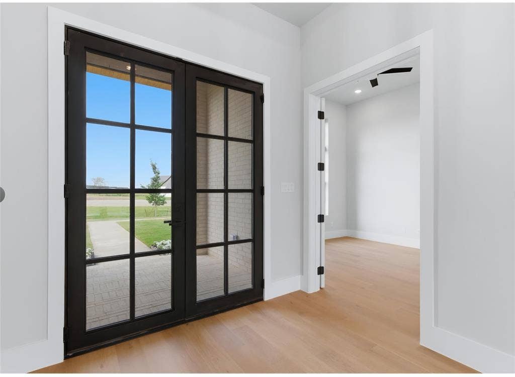 2608 Southbay, Northlake, TX 76226 Black-framed double glass doors, wood-finish flooring, white walls, and recessed lighting