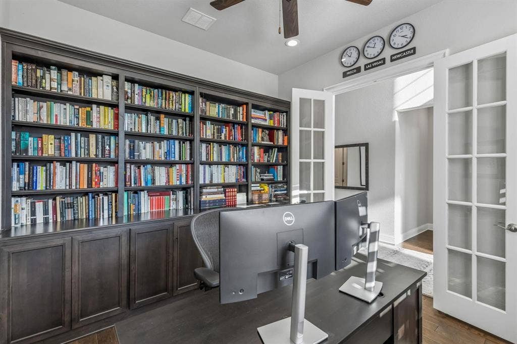 7342 Shoestring Drive, Frisco, TX 75036 Private study with French doors and custom built-in bookshelves creates the perfect work-from-home space.