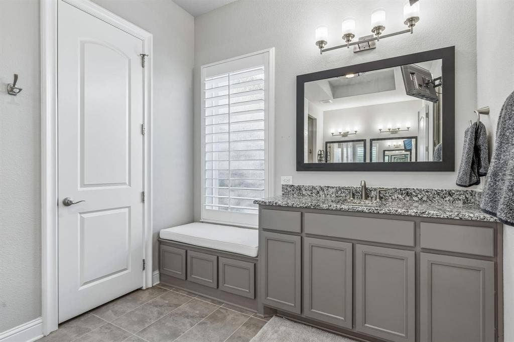 7342 Shoestring Drive, Frisco, TX 75036 Spacious vanity with a built-in bench offers both comfort and convenience.