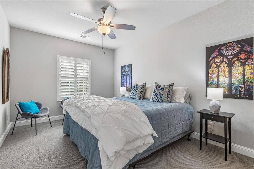 7342 Shoestring Drive, Frisco, TX 75036 Spacious secondary bedroom with a private ensuite bath, providing a comfortable retreat for family and guests.