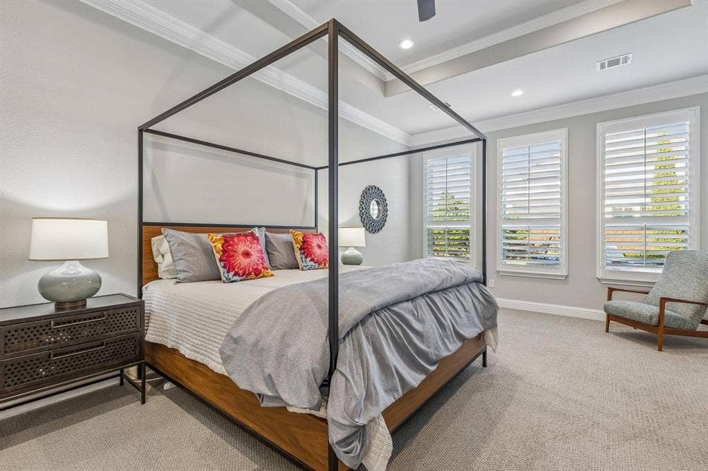 7342 Shoestring Drive, Frisco, TX 75036 Spacious primary bedroom featuring a private sitting area, creating the perfect retreat to relax and unwind.