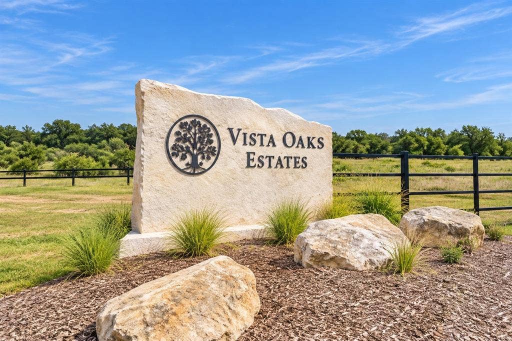 3926 Vista Oak Drive, Royse City, TX 75189 Stone monument sign featuring etched lettering and an ornamental tree emblem