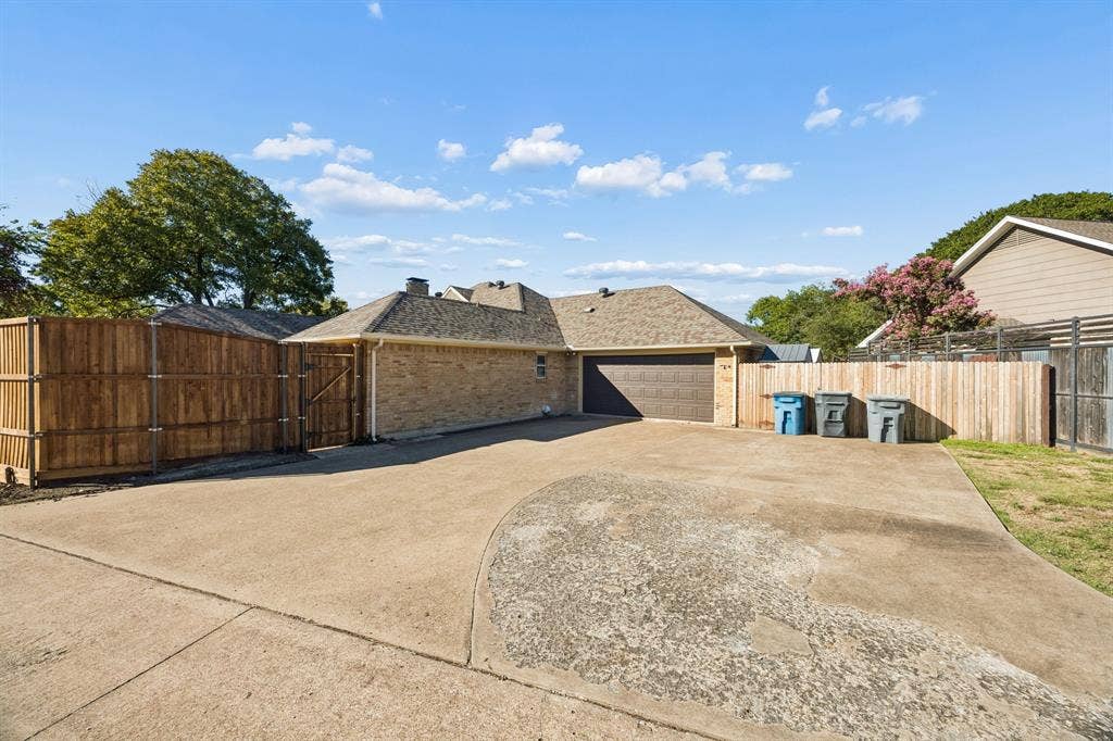 10322 White Rock Place, Dallas, TX 75238 Oversized driveway provides ample space for additional parking.