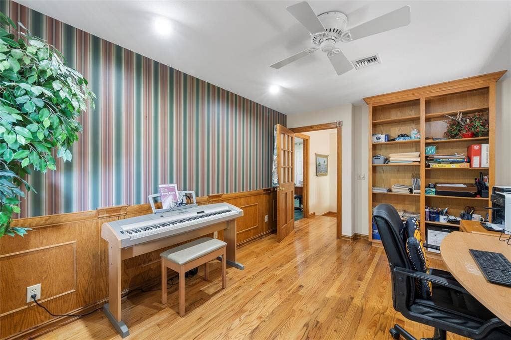 2029 Speegleville Road, Woodway, TX 76712 Hardwood flooring throughout, built-in shelving, wainscoting, ceiling fan, and recessed lighting