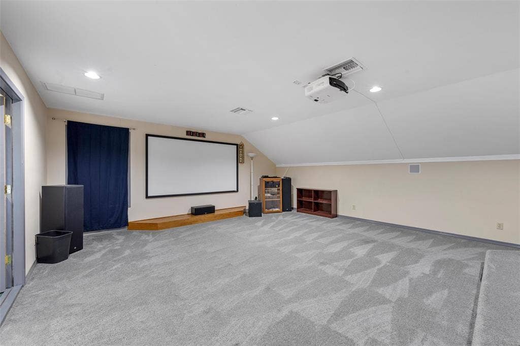 2029 Speegleville Road, Woodway, TX 76712 Spacious room featuring sloped ceilings, recessed lighting, and patterned carpeting