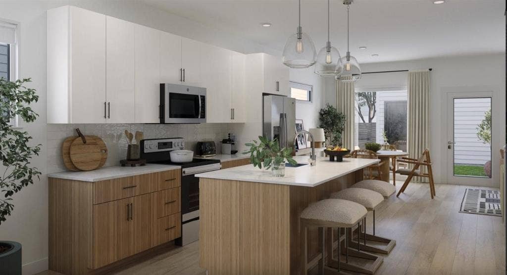 9032 Prairie Path, #3404, Rowlett, TX 75089 Kitchen featuring stainless steel appliances, an island with sink, a kitchen breakfast bar, tasteful backsplash, and hanging light fixtures