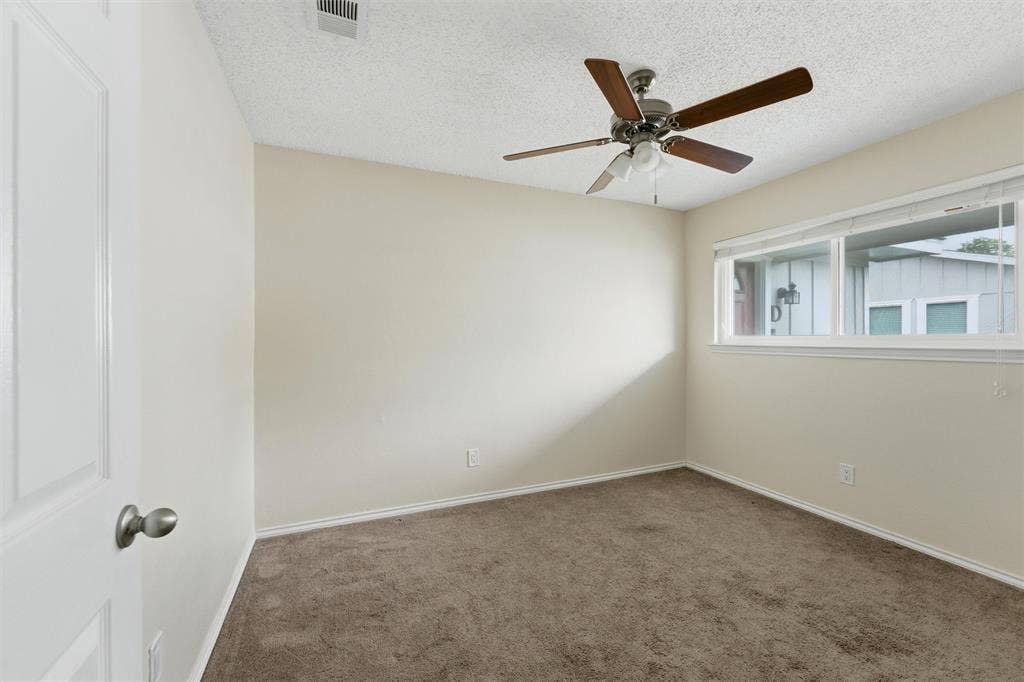 401 N 7th Street, #C, Midlothian, TX 76065 Recessed window, ceiling fan with light kit, textured ceiling, neutral wall color, and wall-to-wall carpeting