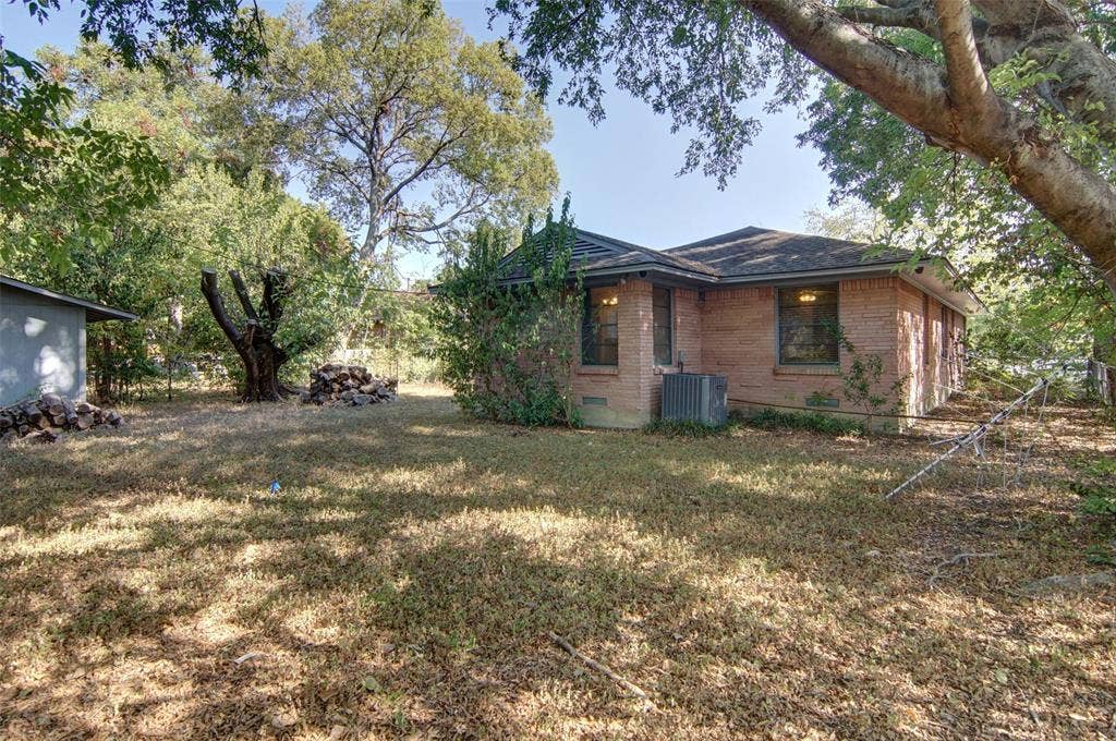 2024 Blake Avenue, Dallas, TX 75228 Brick exterior structure with multiple windows, mature trees, and an accessory building