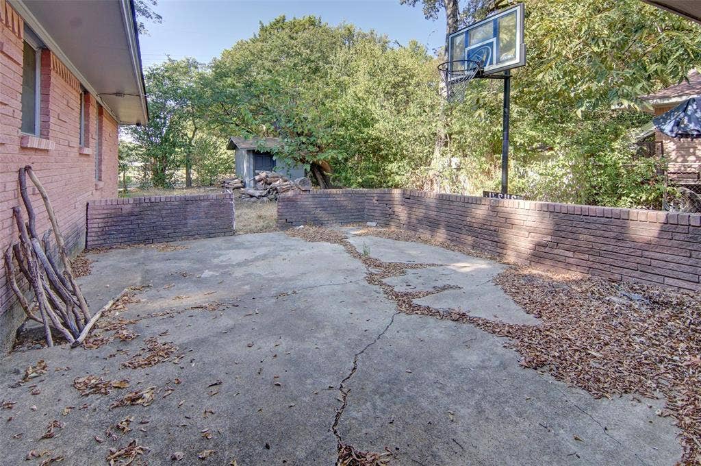 2024 Blake Avenue, Dallas, TX 75228 Brick exterior with an extended concrete pad