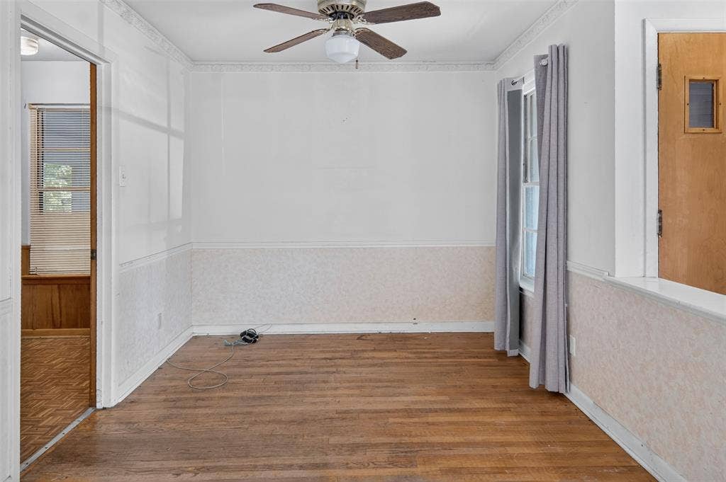 2024 Blake Avenue, Dallas, TX 75228 Hardwood flooring, ceiling fan, wall paneling, window with natural light