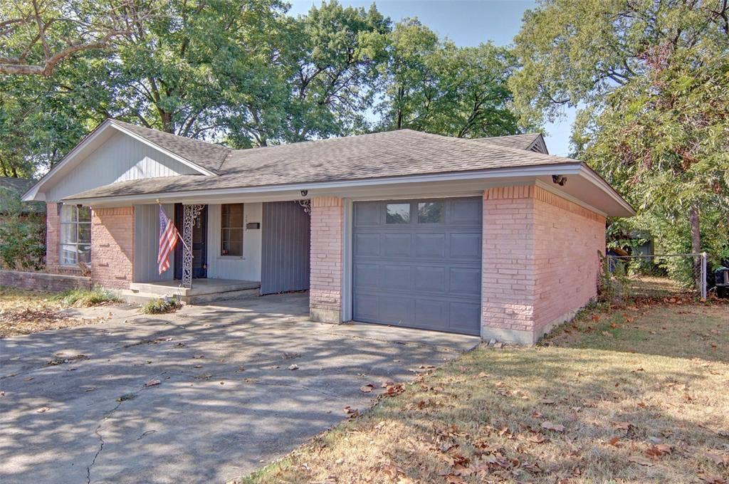 2024 Blake Avenue, Dallas, TX 75228 Brick exterior with a gabled roofline and attached garage