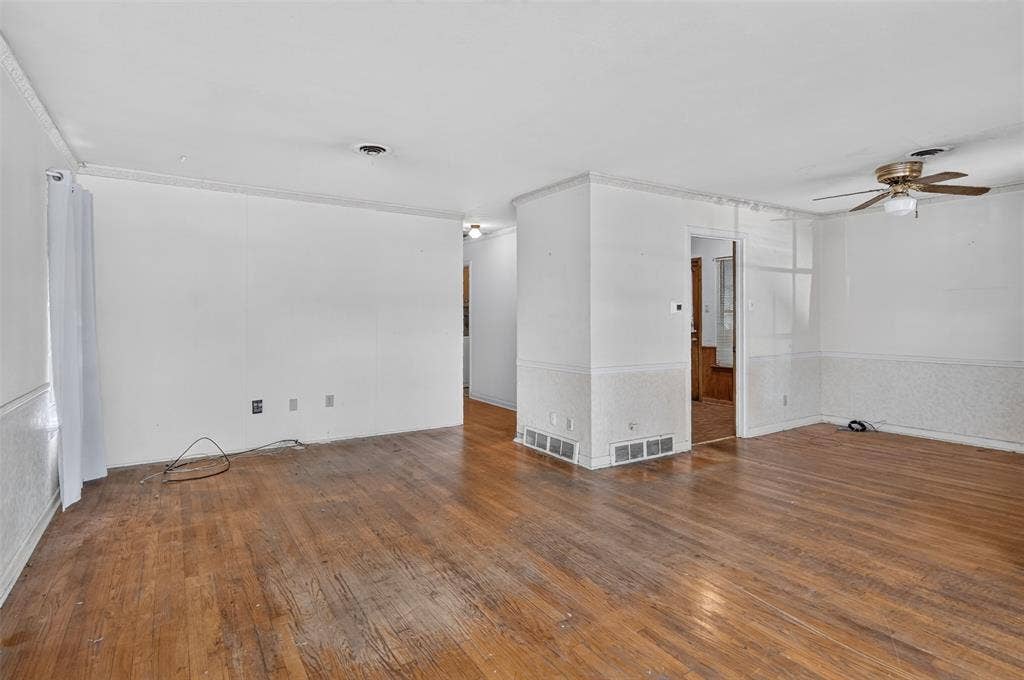 2024 Blake Avenue, Dallas, TX 75228 Hardwood flooring, crown molding, ceiling fan, and white walls
