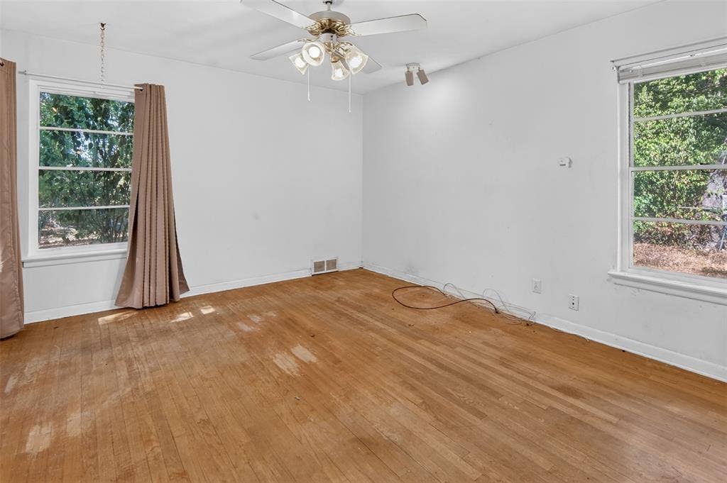 2024 Blake Avenue, Dallas, TX 75228 Hardwood flooring throughout, with multiple windows providing natural illumination
