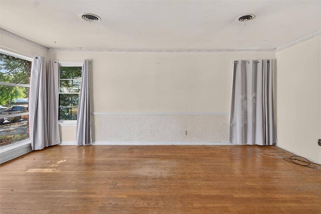 2024 Blake Avenue, Dallas, TX 75228 Wood-finish flooring with multiple windows and crown molding