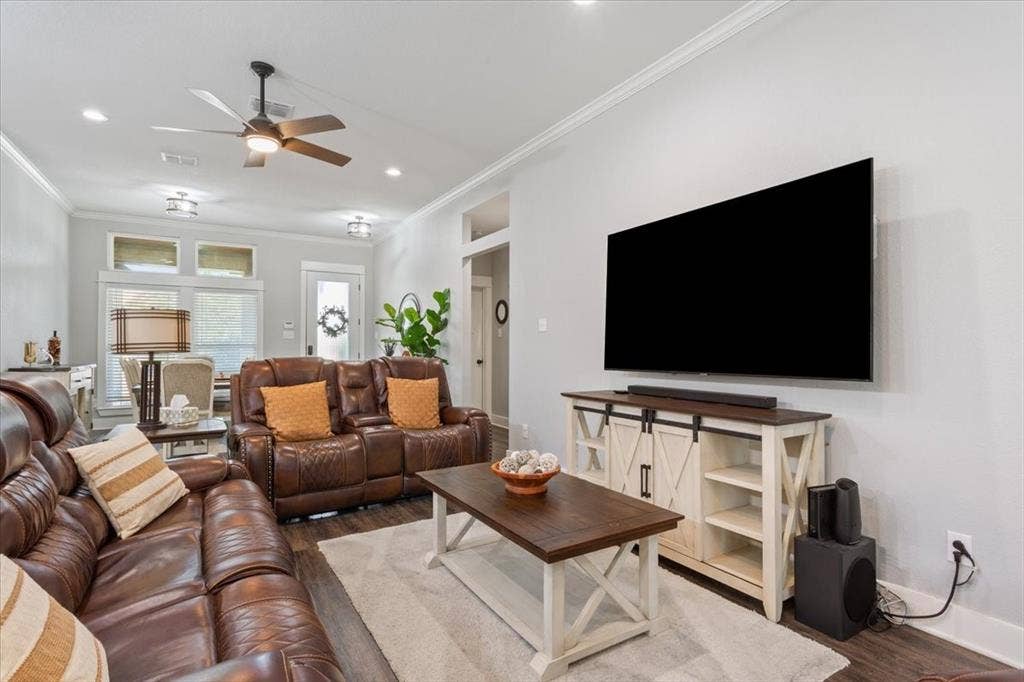 10305 Creekside Lane, Waco, TX 76712 Recessed lighting, crown molding, wood-finish flooring, and a ceiling fan with integrated lighting