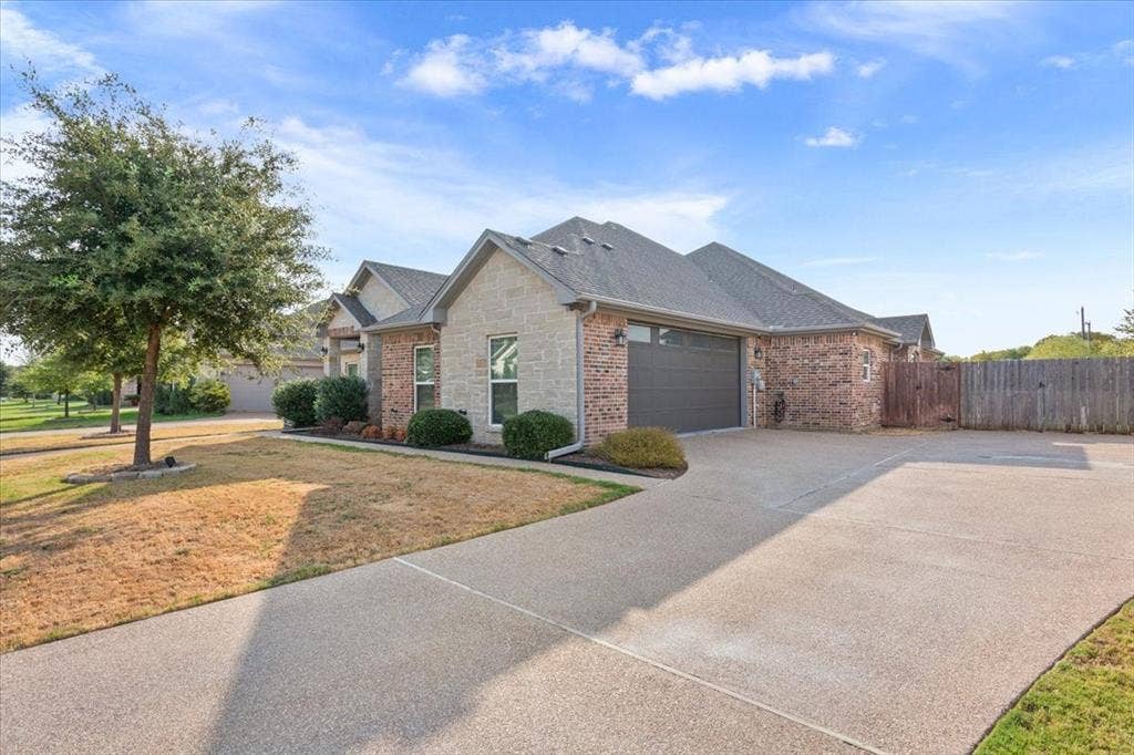 10305 Creekside Lane, Waco, TX 76712 Brick and stone exterior with gabled roof lines