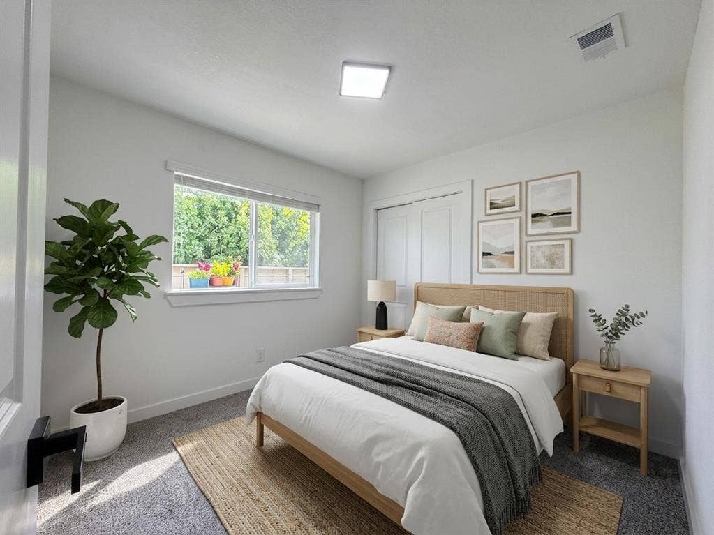 1424 E Parker Road, Plano, TX 75074 Wall-to-wall carpeting, window with blinds, and white bi-fold closet doors