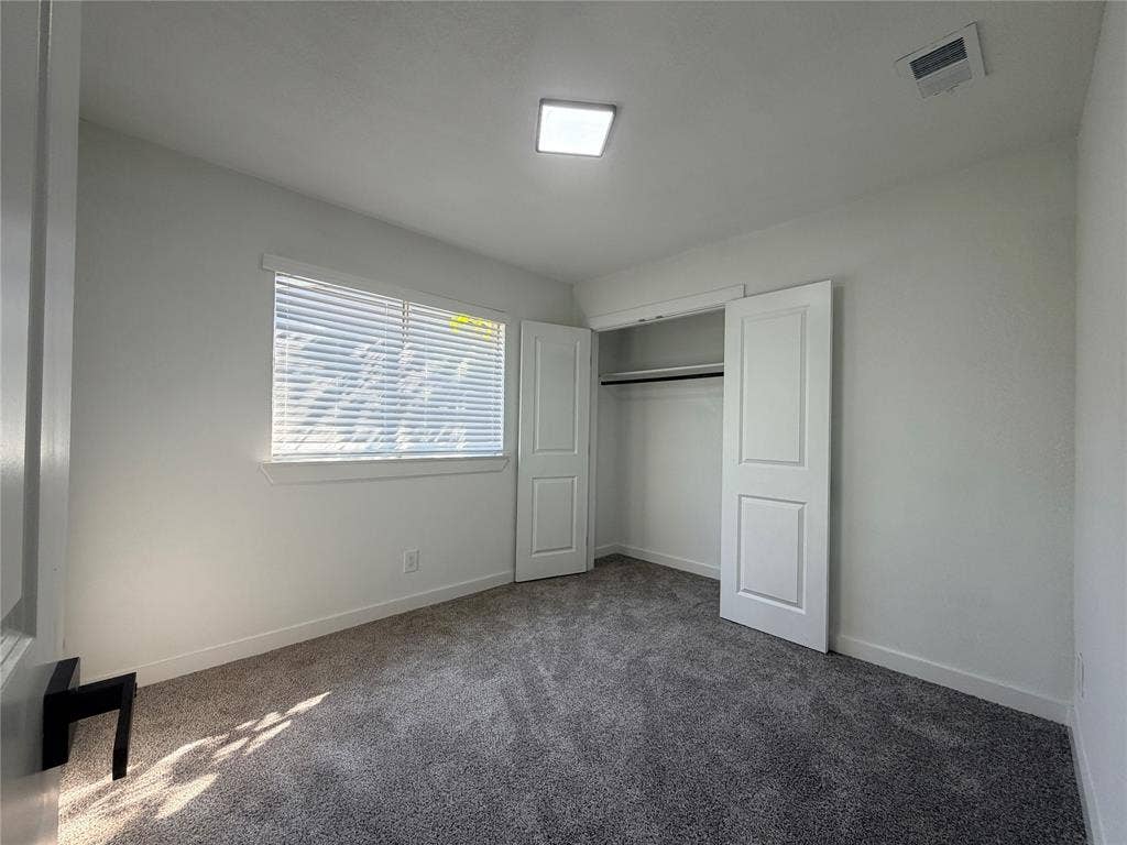 1424 E Parker Road, Plano, TX 75074 Recessed ceiling lighting, window with horizontal blinds, carpeted flooring, and a built-in closet with double panel doors
